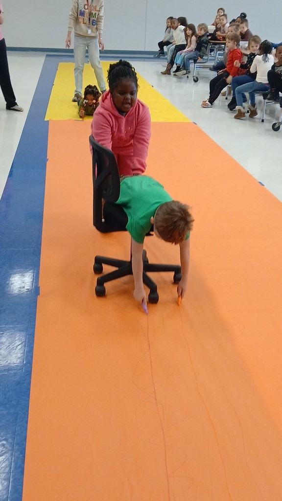 Pre-K Students using various size tools to help complete a task