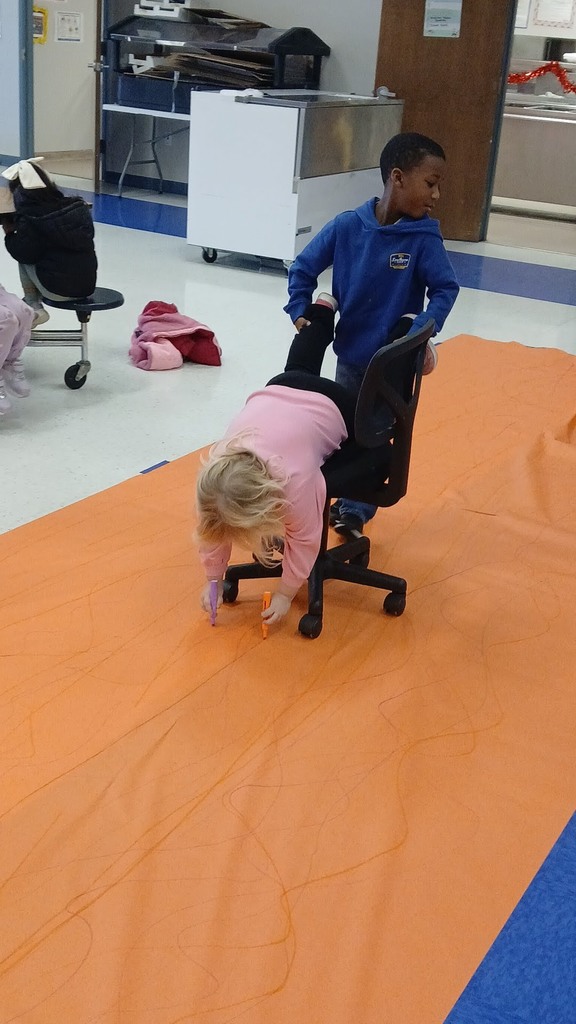 Pre-K Students using various size tools to help complete a task