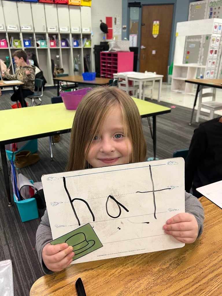 Students encoding words in Ms, Zoe's Kindergarten Class