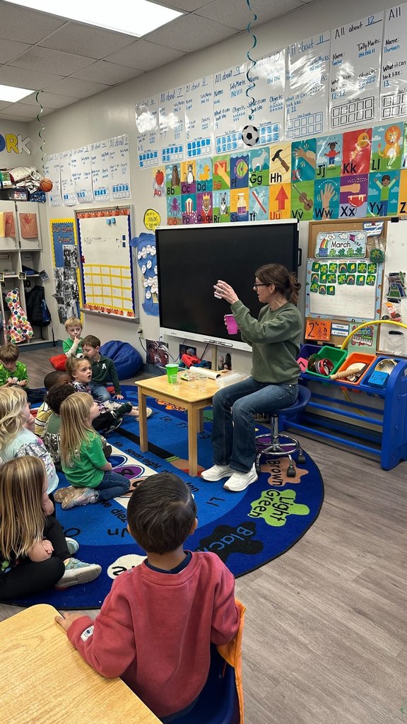 Mrs Wendy leading a science experiment with Pre-K Students