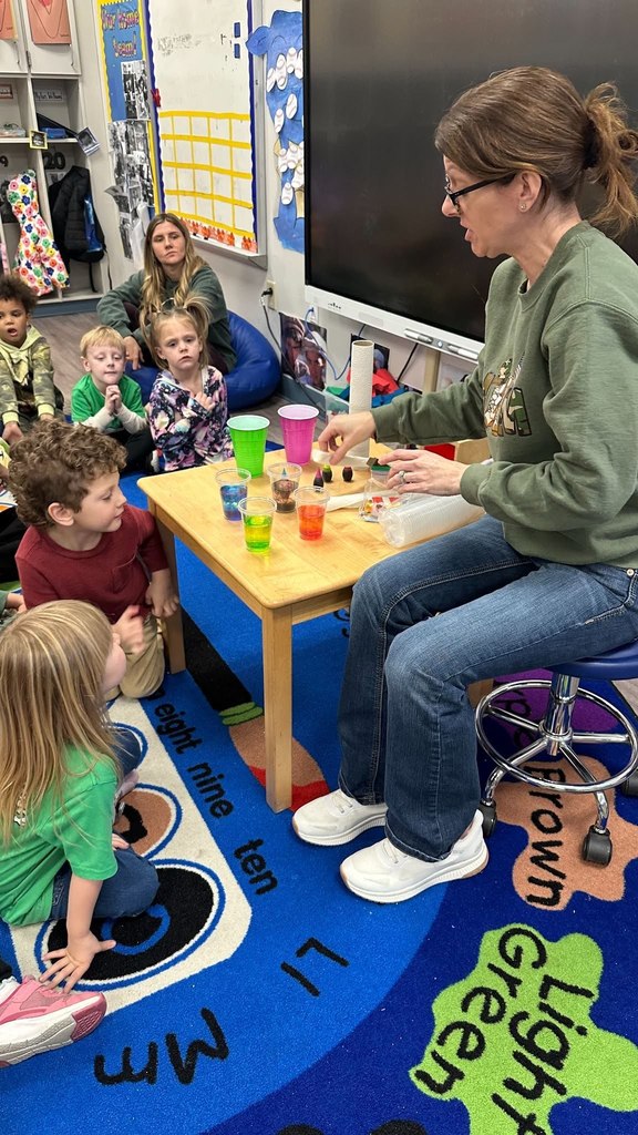 Mrs Wendy leading a science experiment with Pre-K Students