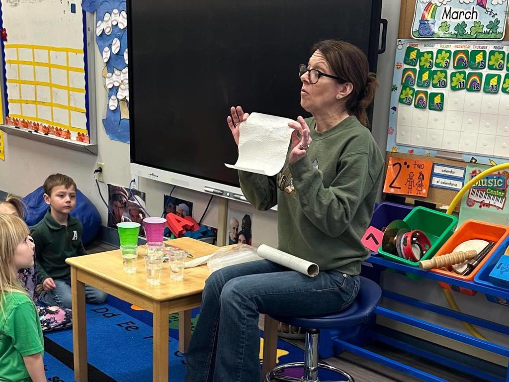 Mrs Wendy leading a science experiment with Pre-K Students