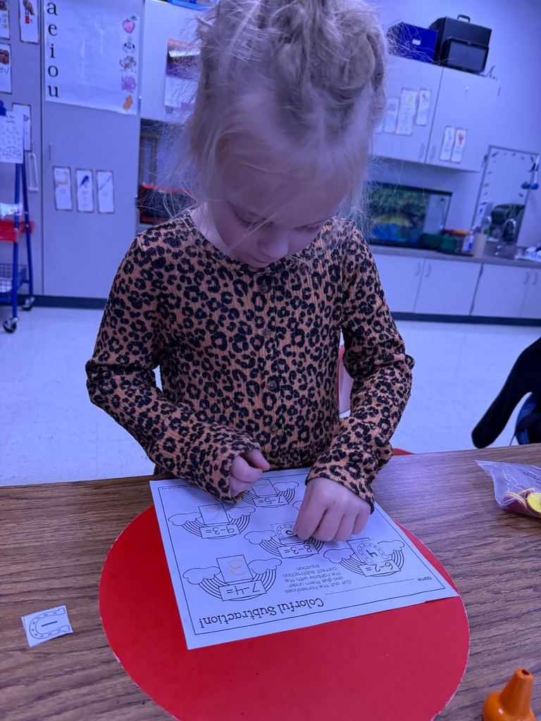 In Mrs. Vanessa’s Class we are really working our minds and our fine motor skills. We are cutting, glueing, comparing, and stringing beads!