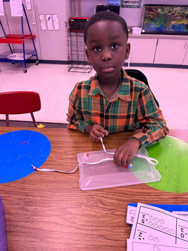 In Mrs. Vanessa’s Class we are really working our minds and our fine motor skills. We are cutting, glueing, comparing, and stringing beads!