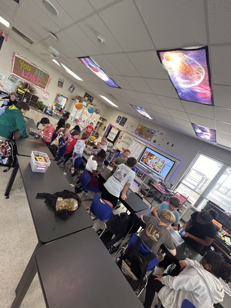 5th Grade Scientists creating terrariums 