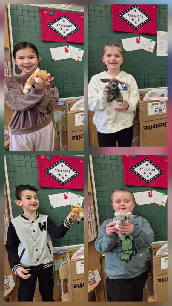 Students in Ukrain posing with artwork created and sent to them by DES Students