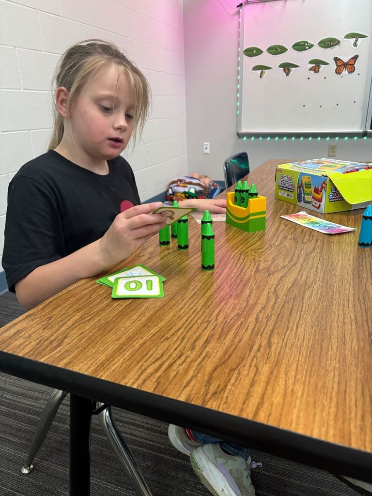 Student building large crayons