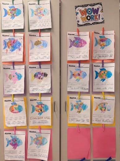 Rainbow Fish project pictures hanging on the board
