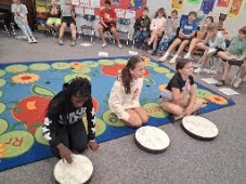 students playing drums in music