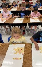 students working in Mrs. Joanna's class