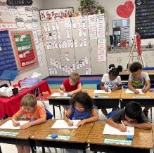 students working in Mrs. Joanna's class