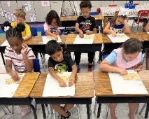 students working in Mrs. Joanna's class