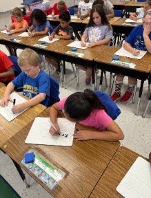 students working in Mrs. Joanna's class