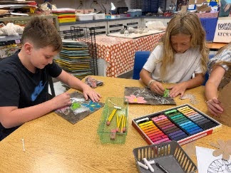 students working with oil pastels