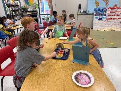 students painting with water colors