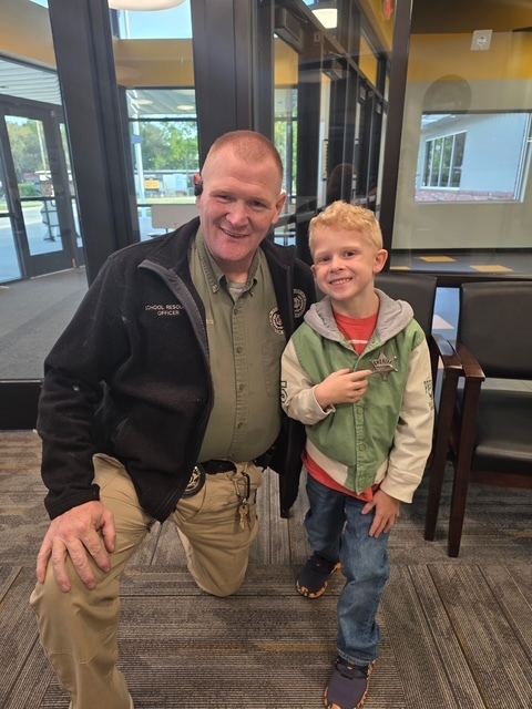 Diamond School Resource Officer (SRO), Deputy Zimmerman, and Diamond Elementary's SRO for the Day Winner, "Sheriff" Henry