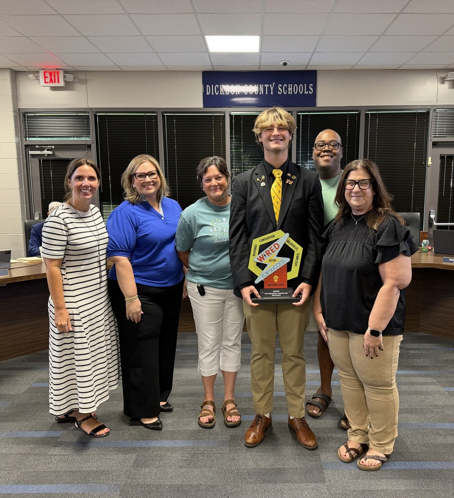 Dr. Misty Marvin and educators from Creek Wood standing with Reese Kelso, holding his award for being elected National BETA Vice President.