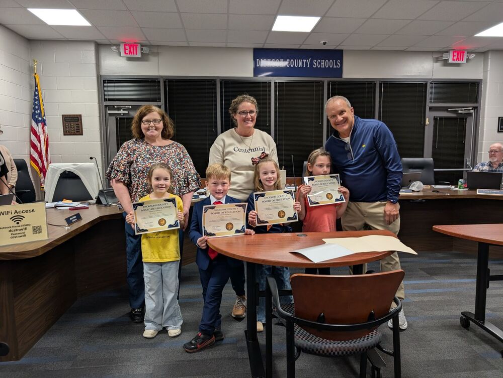 Charlie Marvin, Audrey Natterstad, Evelyn Akins, and Layla Clark proudly led board members, district leaders, and guests in the pledge to open the meeting.