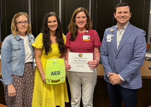 Director of Student Health Mary Morrow was joined by Kathy Hickerson and Wyatt Chocolate to recognize and thank Horizon Medical Center for their generous contribution of 16 new Automated External Defibrillators (AEDs).
