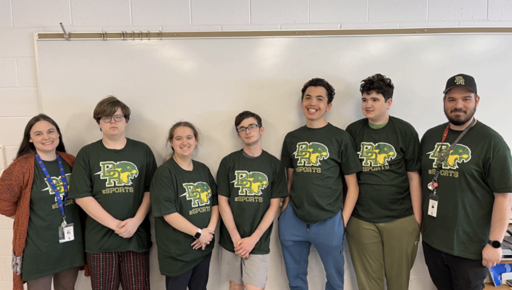 Photo of all esports students and coaches in their esports tee-shirts
