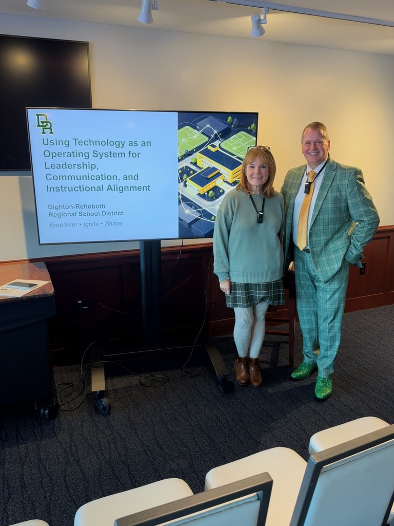 Lauren and Bill pictured in front of their presentation screen at MassCUE