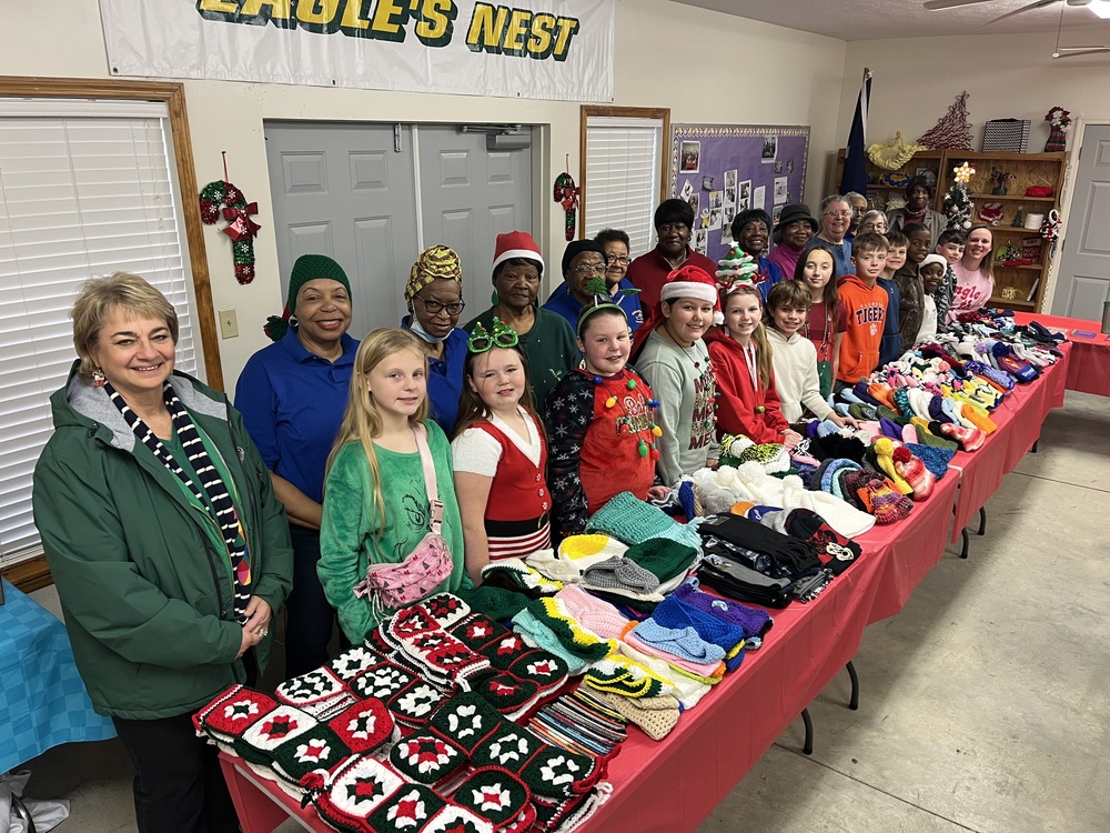 Latta Senior Empowerment Services presenting Latta Elementary Student Council with winter wear donation