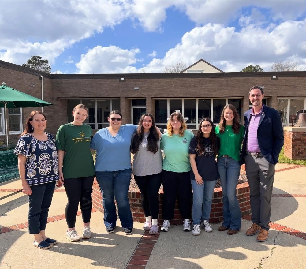 State Teacher of the Year Corey Bedenbaugh pictured with the Teacher Cadets at LHS