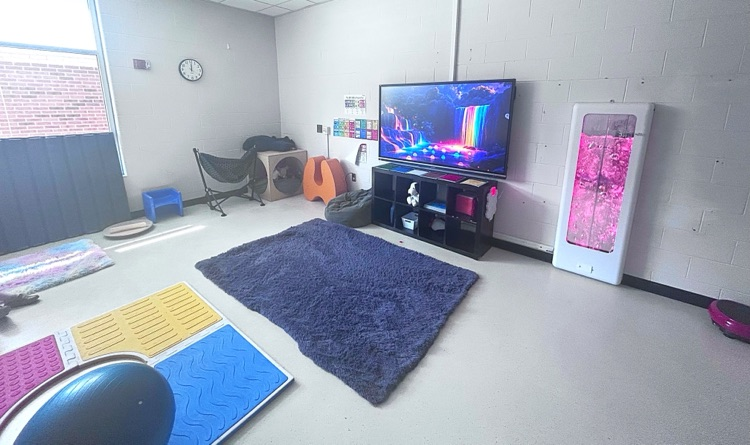 Sensory Room space with bubble machine, peaceful music, a swing and a cozy cubical.