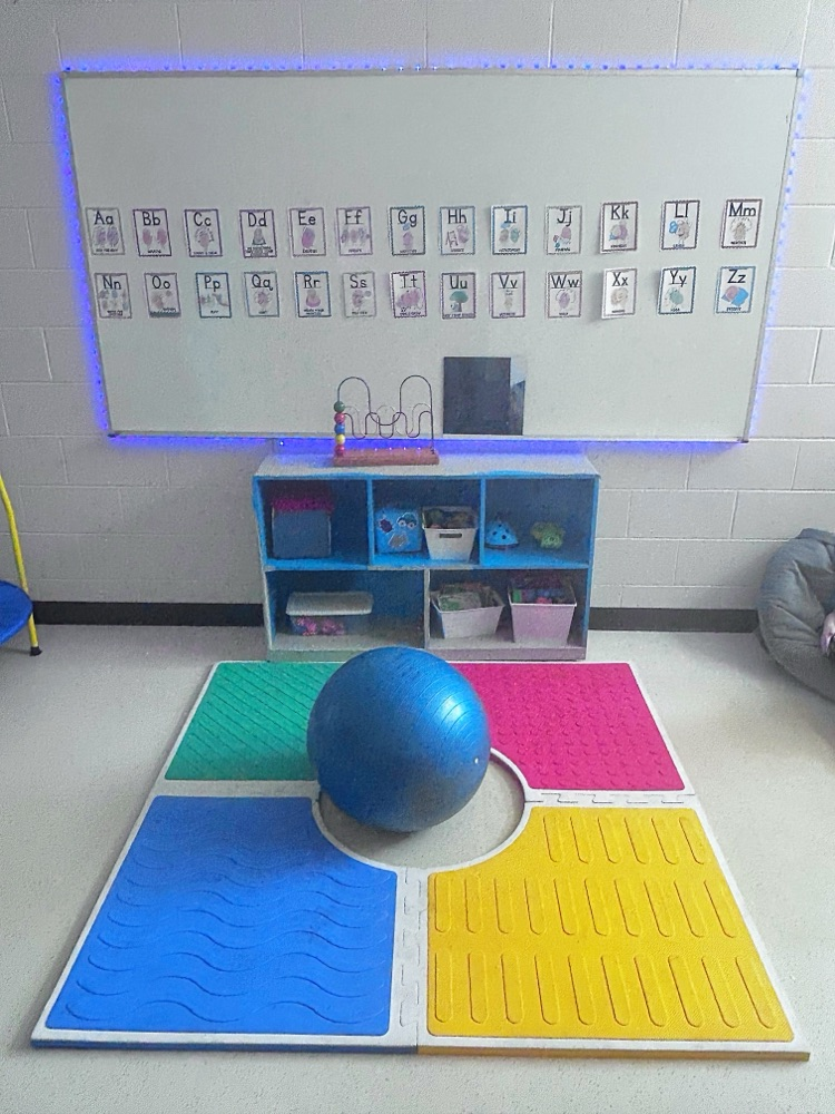 Several different sensory tools, bean bags, balls, textured rugs and mirrors make for the perfect space!