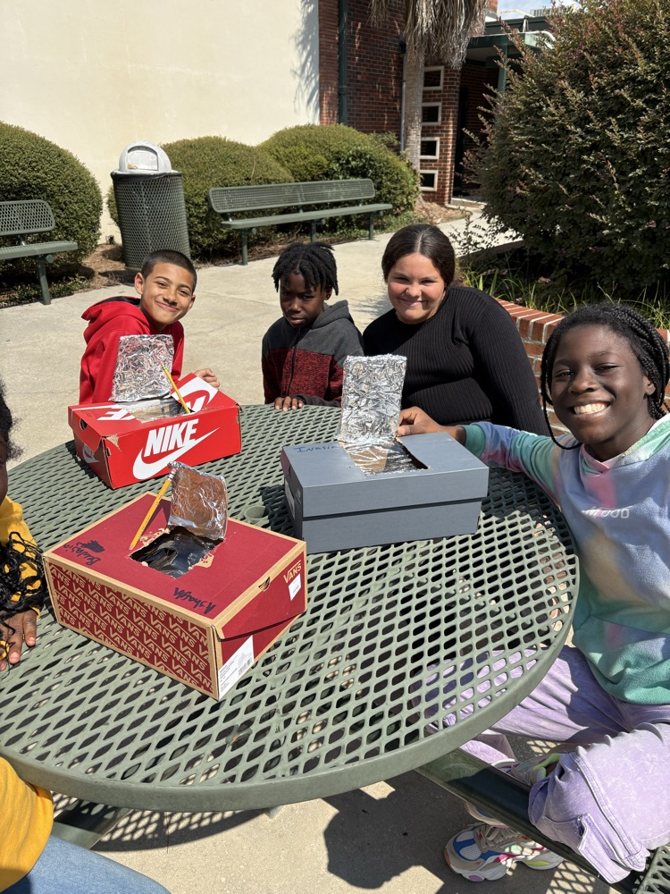 students testing solar ovens 