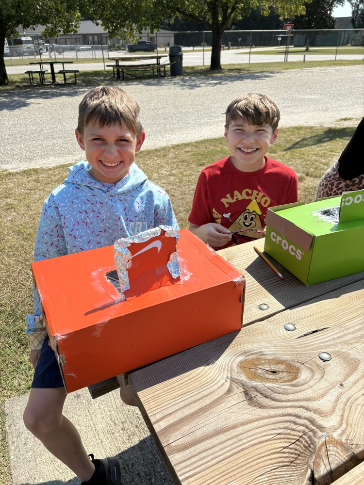 students testing solar ovens 