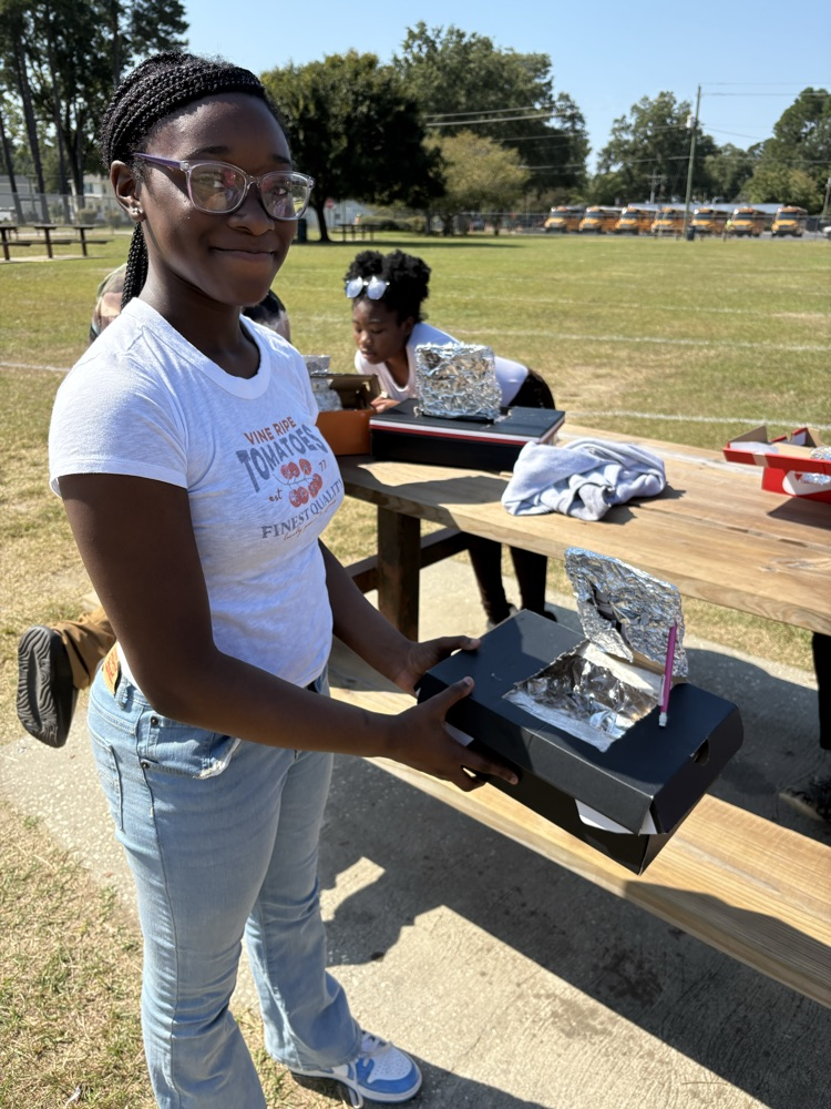 students testing solar ovens 