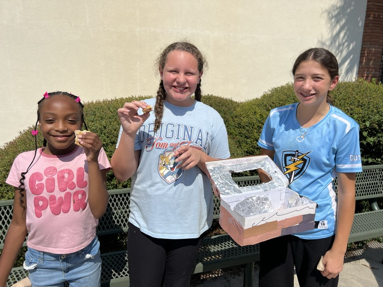 students testing solar ovens 