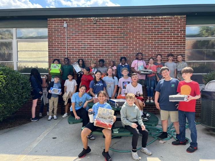 students testing solar ovens