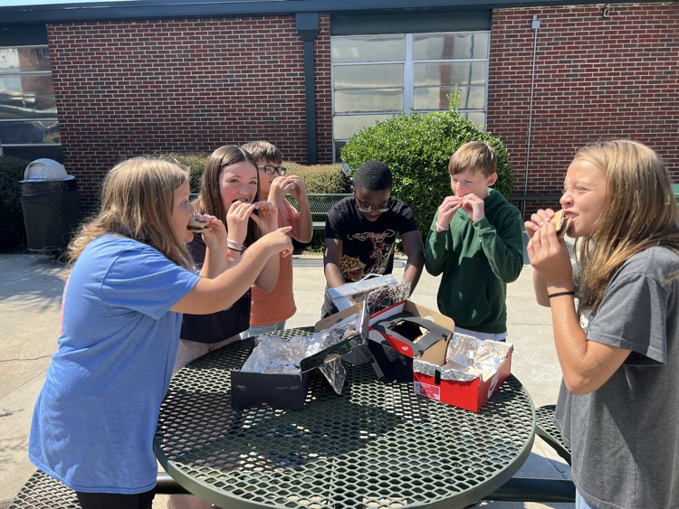 students testing solar ovens