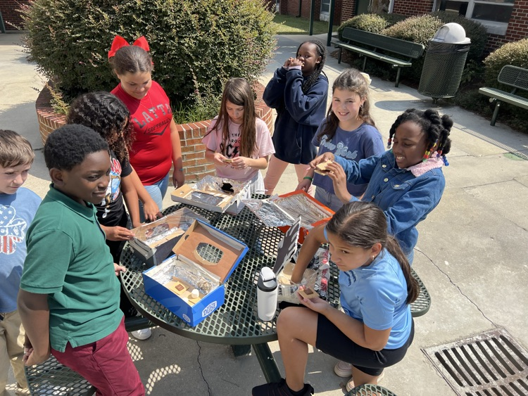 students testing solar ovens 
