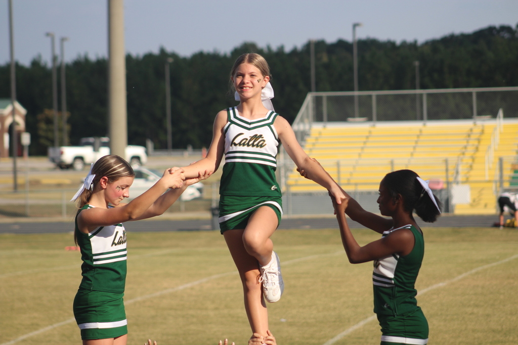 Cheerleaders in stance.