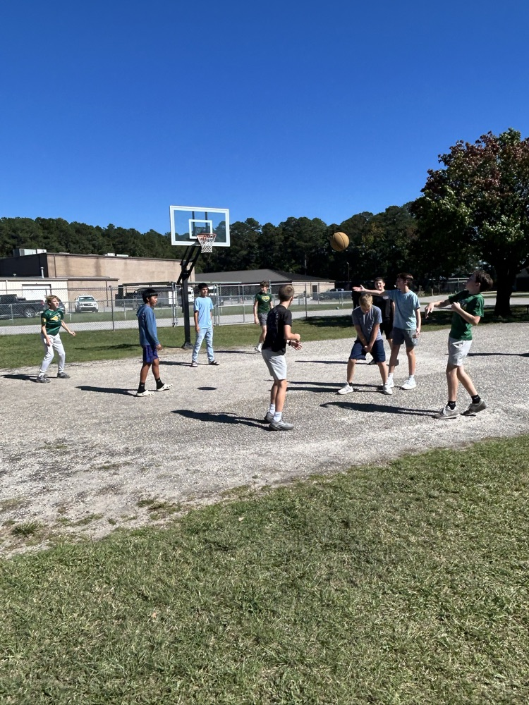 students playing basketball