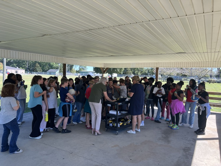 Students watching the prize wheel