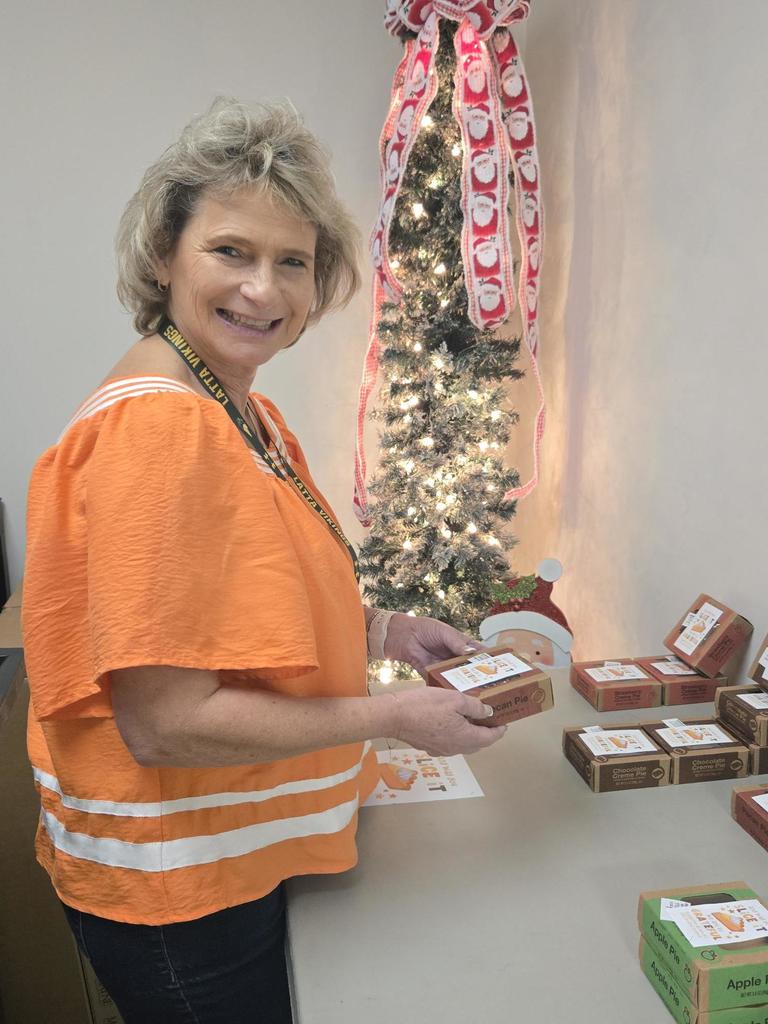 Mrs. Rogers chooses her pie.