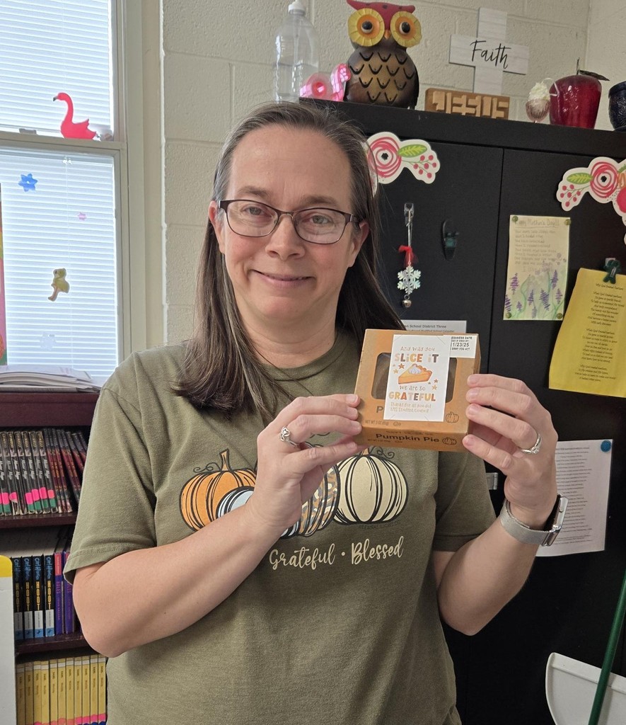 Mrs. Roberts holds her pie.
