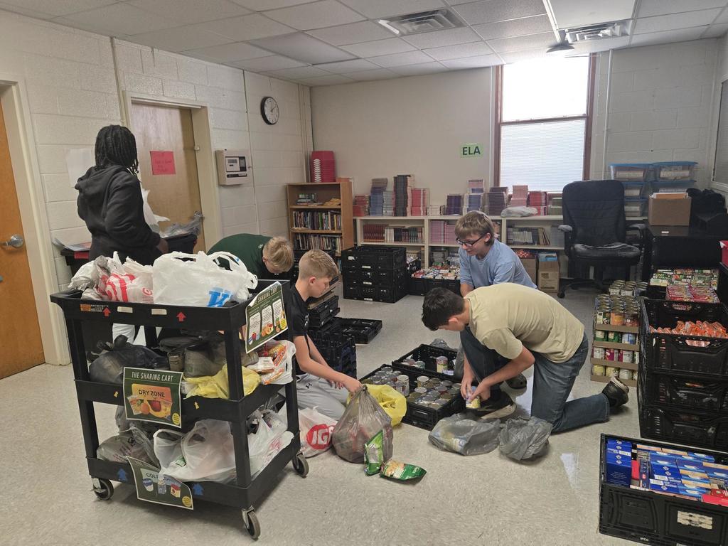NJHS members sorting and counting cans 1