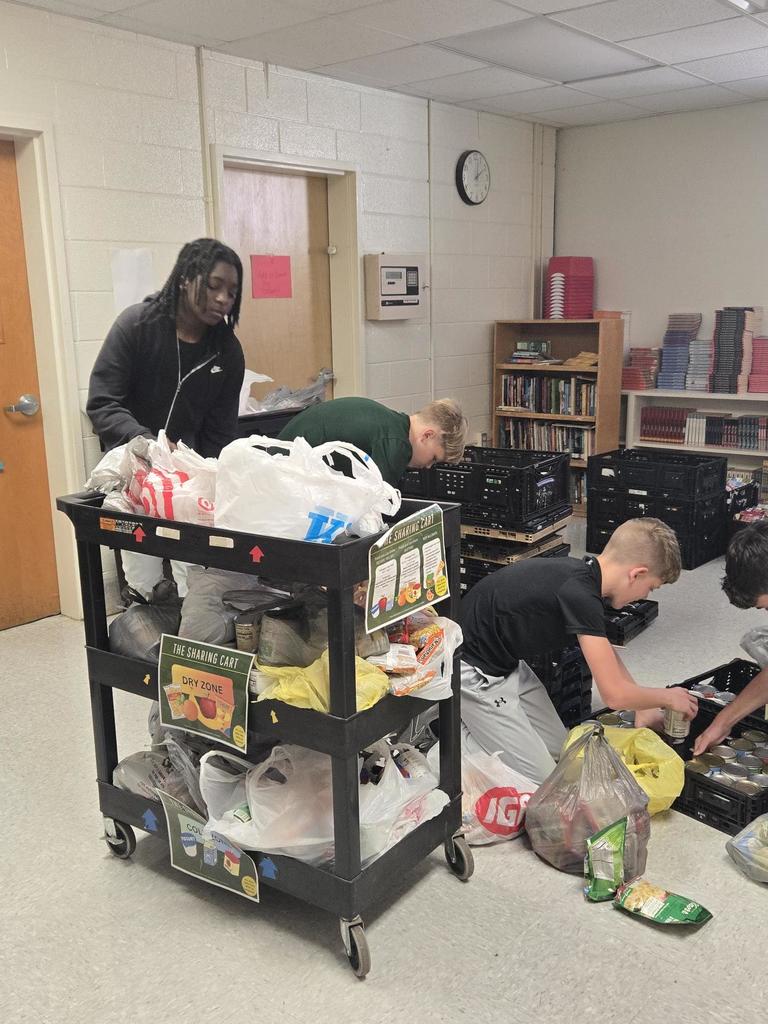 NJHS members sorting and counting cans 2