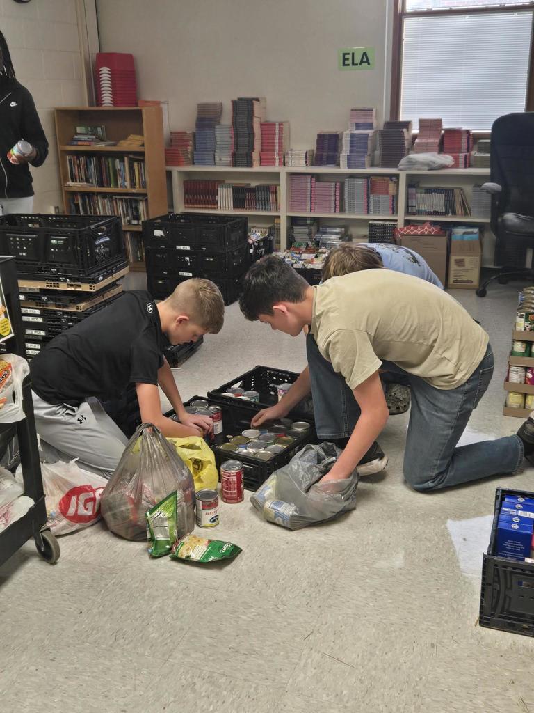 NJHS members sorting and counting cans 3