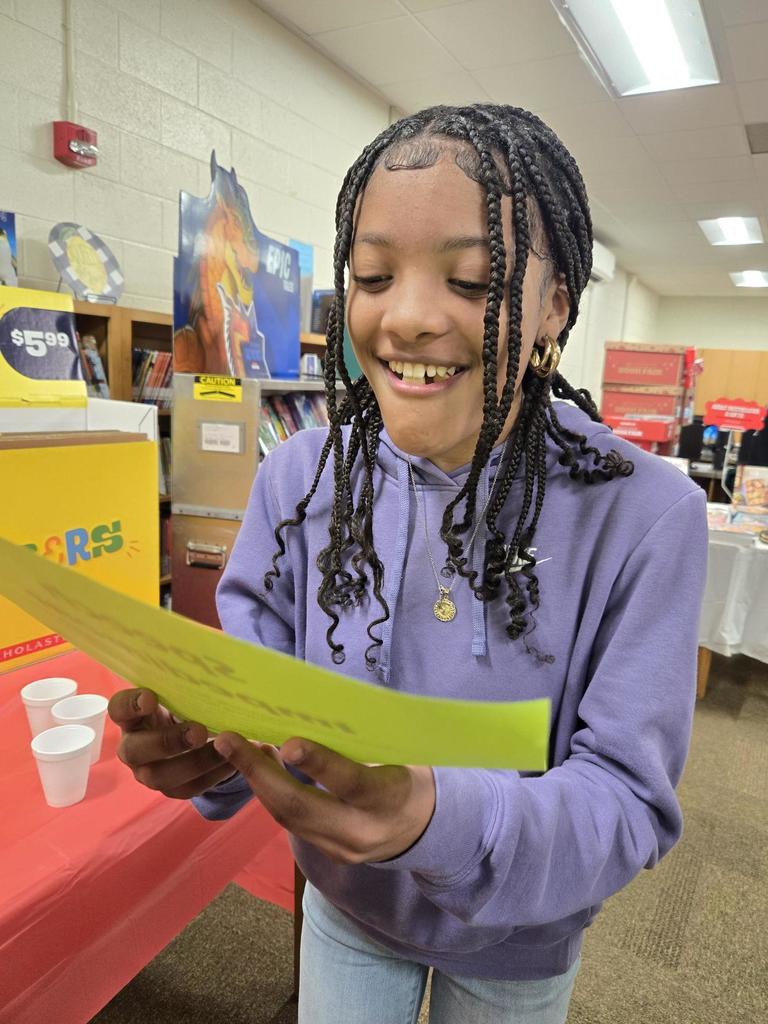 Student attempts to recite a nursery rhyme while holding jelly beans in her mouth to simulate speech impairments.