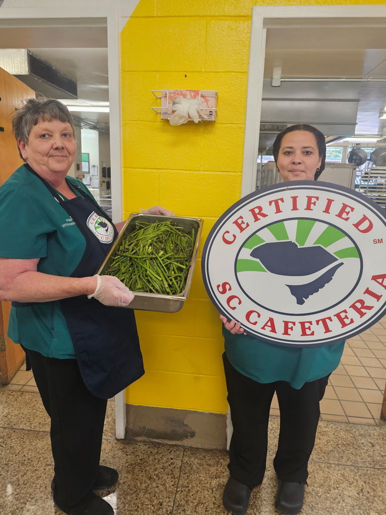 Cafeteria workers preparing asparagus at LMS/LHS cafeteria