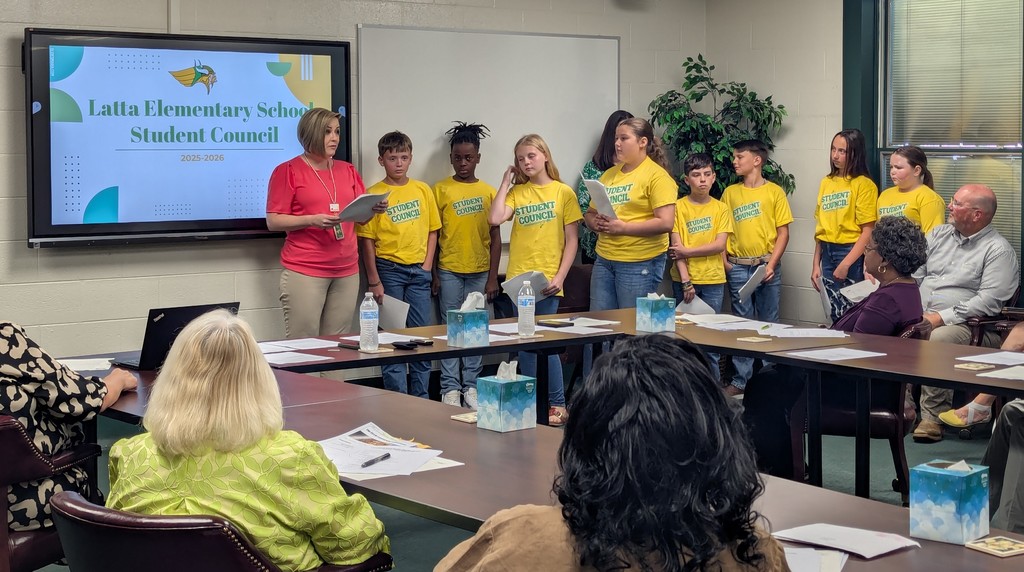 LES Student Council and Mrs. Luffman presenting on the election process for student council and sharing projects they have helped with and led throughout the school year.