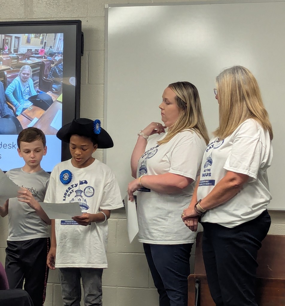 4th grade students and Mrs. Cox and Mrs. Allen presenting on their trip to the State House for Liberty Day