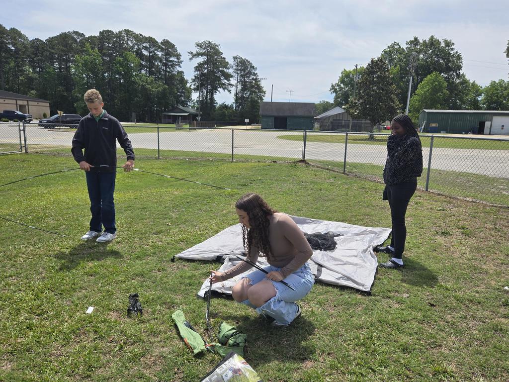 Mr. Rivers teaches how to assemble a tent in ProTeam.