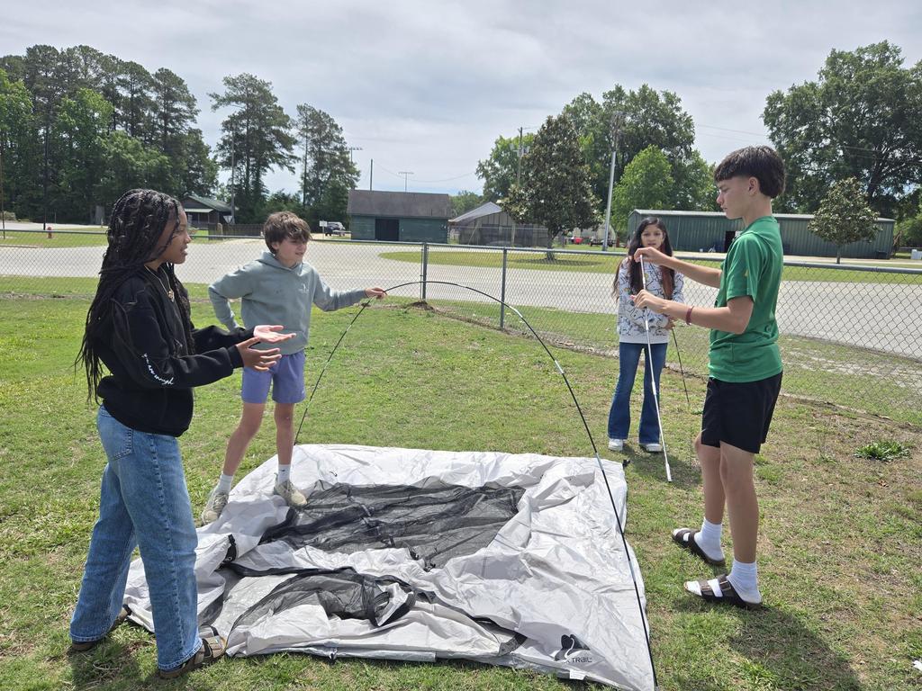 Mr. Rivers teaches how to assemble a tent in ProTeam.